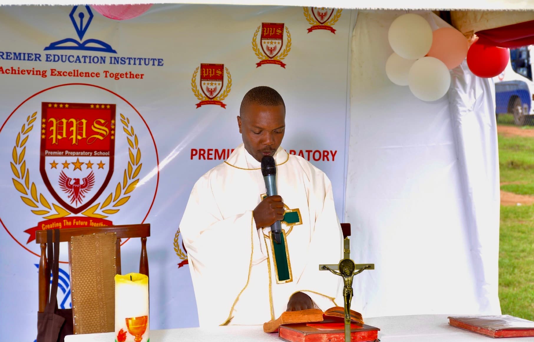 Rev. Fr. Ssekatawa leading the holy mass on Speech Day